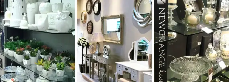 Shelves display white ceramics, potted plants, glassware, mirrors, and home decor items in a well-lit shop, with assorted decorative pieces creating a stylish, organised setting.
